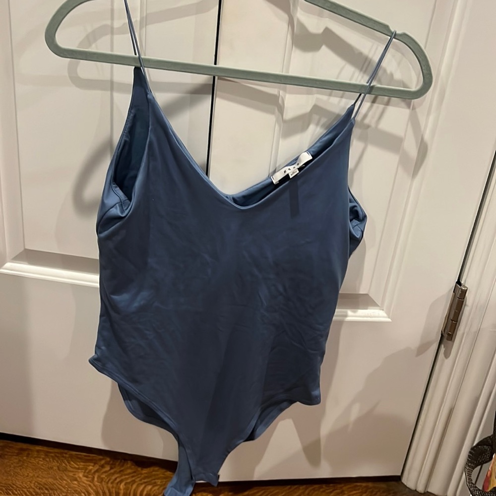 Blue bodysuit.